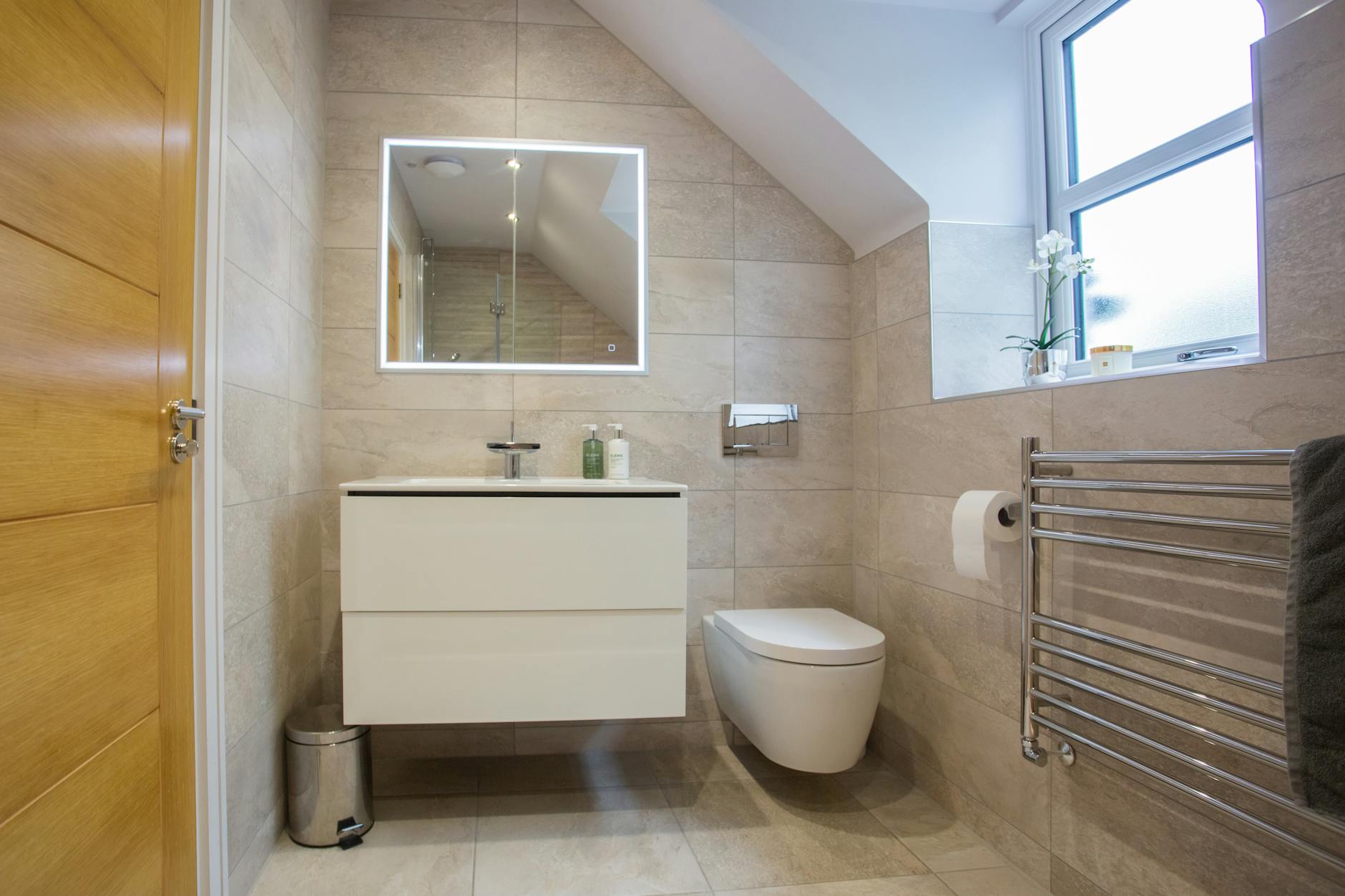 sink and toilet seat in bathroom